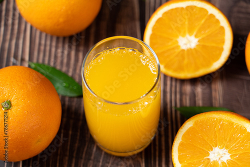 Fresh Orange Juice in a Glass on table.