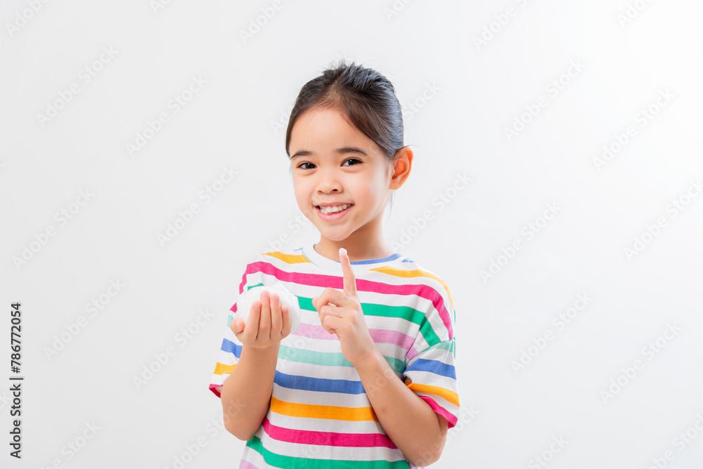 Cute Asian girl, holding foam, washing her face Cute Asian girl, holding foam, washing her face