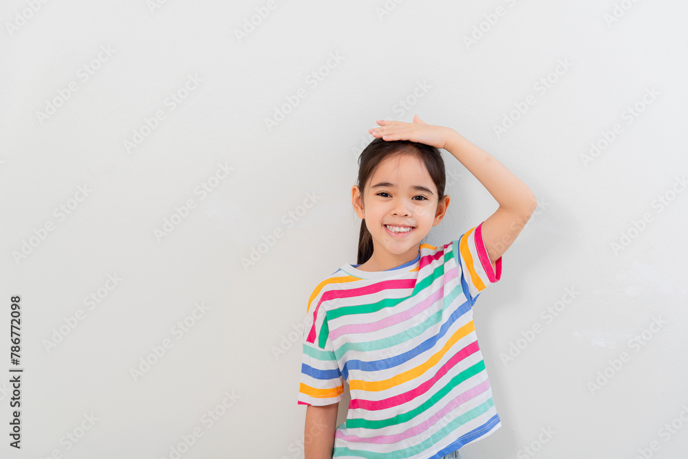 Cheerful Asian girl Posing cutely on a white background Cheerful Asian girl Posing cutely on a white background