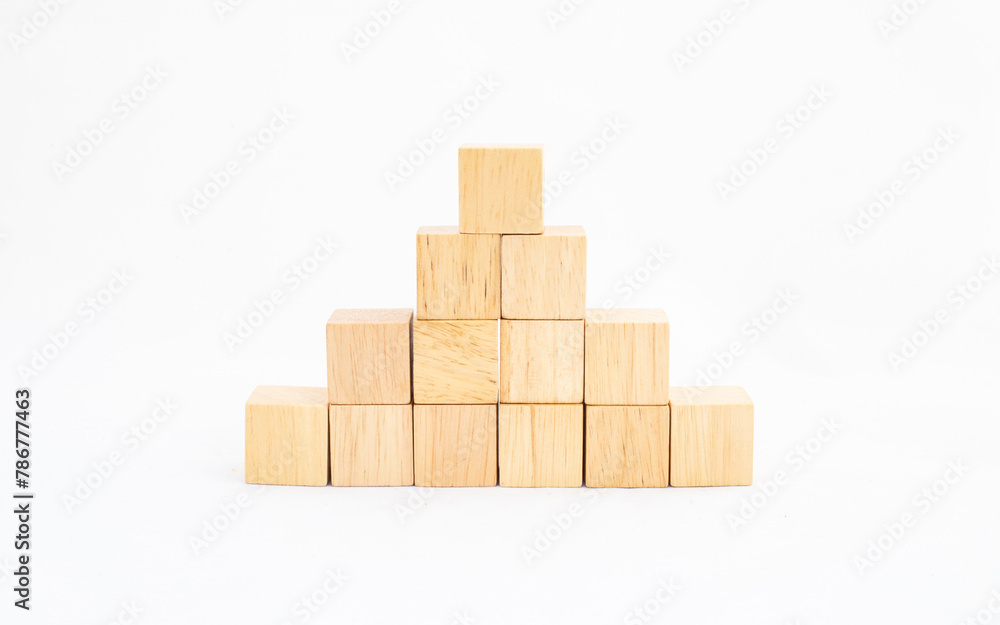 Wooden blocks stacked in the shape of a pyramid. Empty space for business concept templates. Wooden blocks stacked in the shape of a pyramid. Empty space for business concept templates.