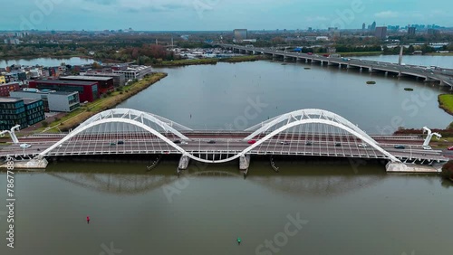 Aerial drone view of modern Enneus Heerma Bridge Amsterdam Netherlands. High quality 4k footage photo