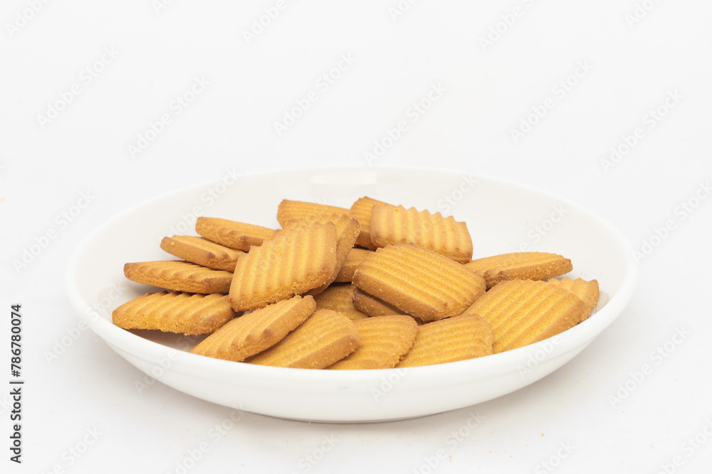 Crunchy tea biscuits in plate on white isolated background Crunchy tea biscuits in plate on white isolated background