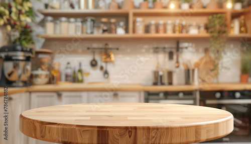 A kitchen with a wooden table in the center. The table is empty and has a view of the kitchen