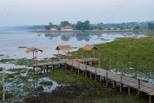 Chiang Saen Lake's Bamboo Jetty: Serene bamboo structure extending over tranquil waters, a picturesque spot for relaxation photo