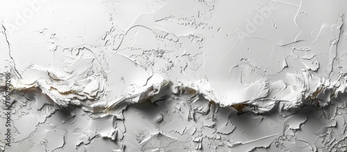 Close-up view of a white wall completely covered with a fresh coat of white paint photo
