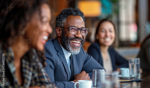 Joyful Multi ethnic Business Team Engaging in Lively Discussion at a Café