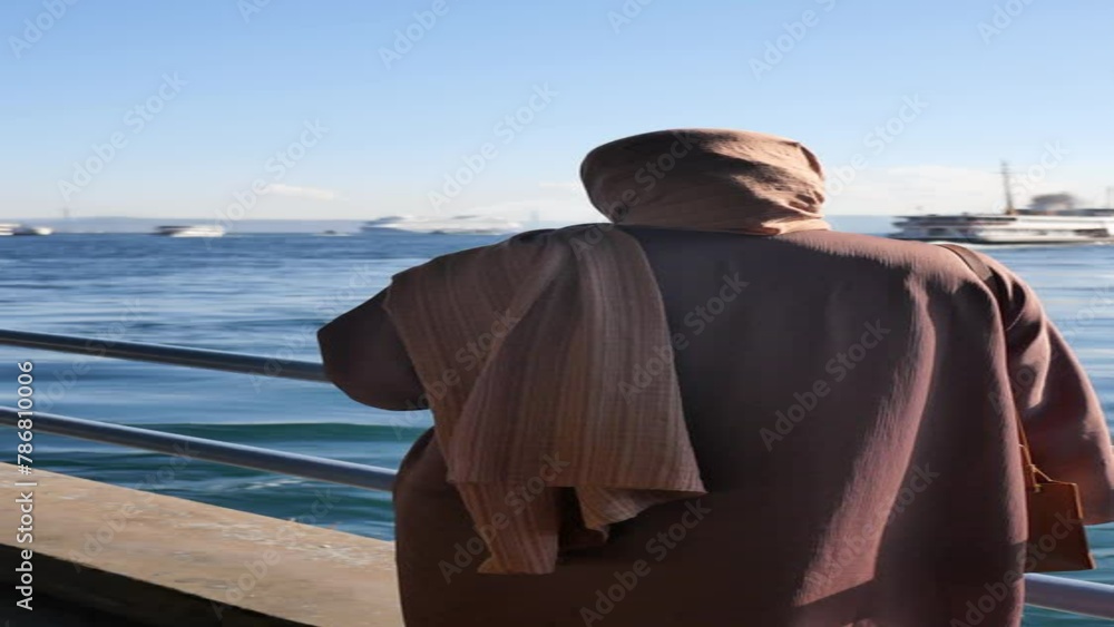 Unhappy girl standing at bench .