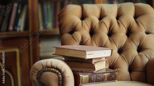 A chair with three books stacked on top of it