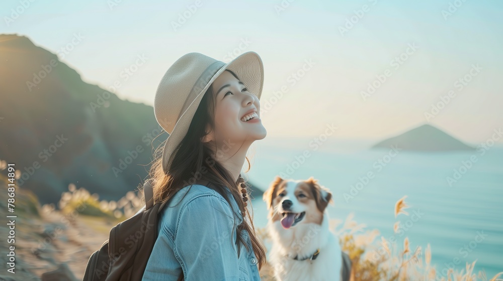 beautiful smile of tourist woman. she's traveling with dog. Sea and mountain background beautiful smile of tourist woman. she's traveling with dog. Sea and mountain background
