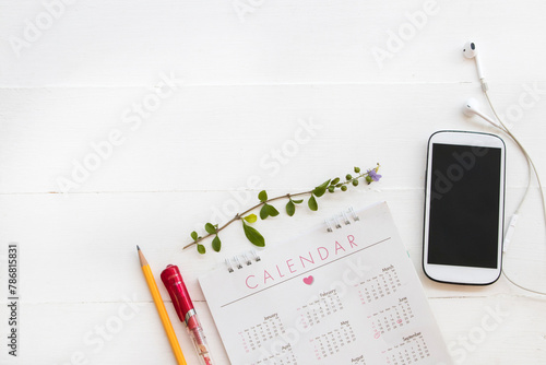 calendar whtie mobile phone for business work arrangement flat lay style on background white 