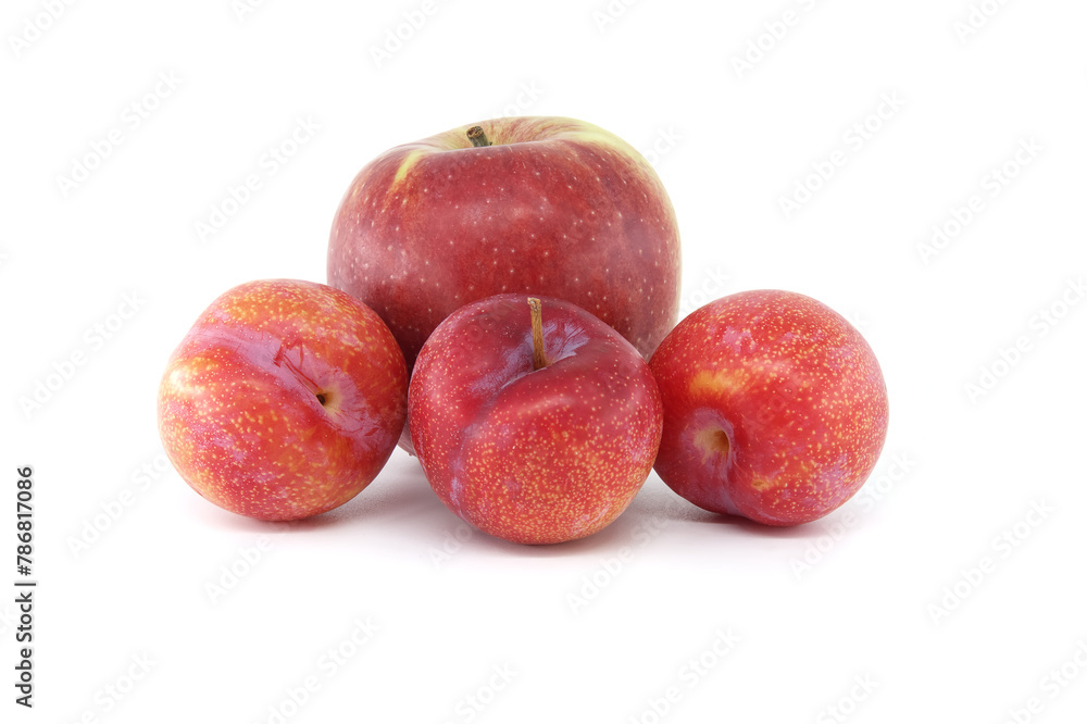 Crimson plums and red apple isolated on white Crimson plums and red apple isolated on white