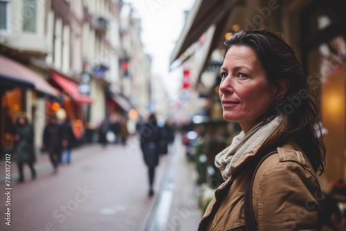 Portrait of middle aged woman walking on a street in Paris, France
