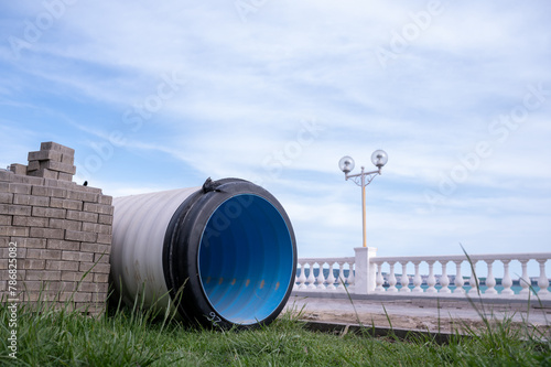huge sewer pipes, sewerage construction on the embankment. High quality photo