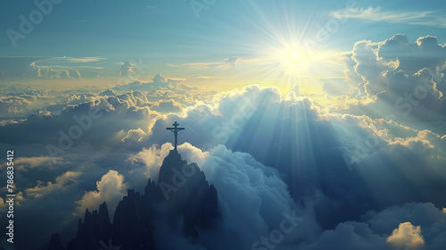 A cross is on top of a mountain in the clouds photo
