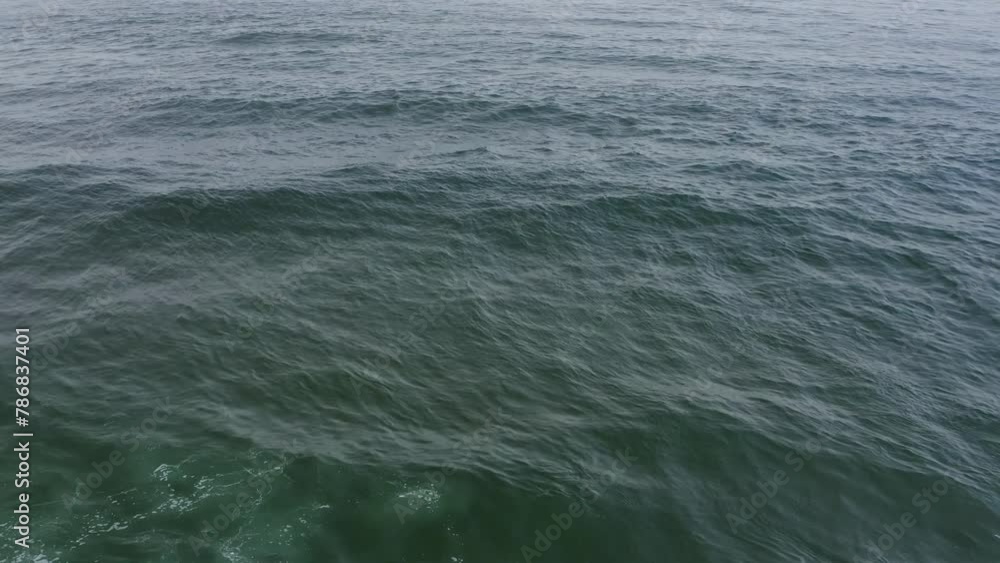 Open water of the Pacific Ocean gently rolling, aerial view, looping background. Oregon Coast. Open water of the Pacific Ocean gently rolling, aerial view, looping background. Oregon Coast.