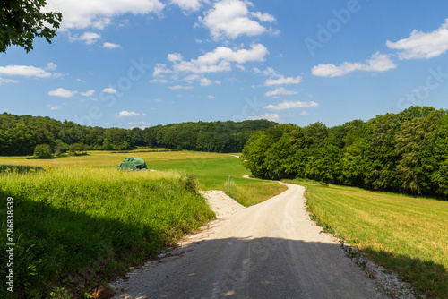 Hiking path, hill panorama, meadows, forest with trees near Wichsenstein in Franconian Switzerland, Germany