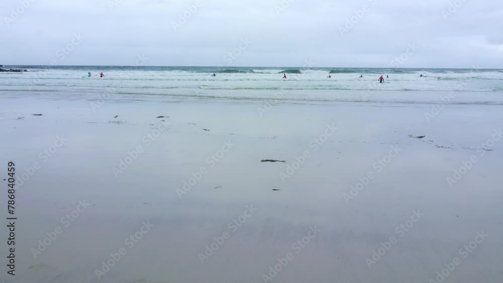 Beginners practice surfing. Lofoten Islands, Northern Norway. Beginners practice surfing. Lofoten Islands, Northern Norway.