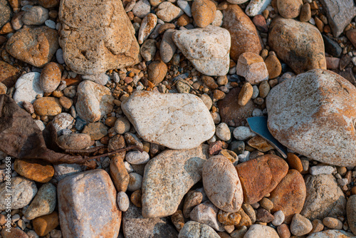 Stone wall background, Different color beach stones background.