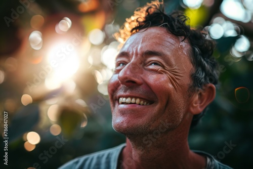 Portrait of a smiling middle-aged man in the garden.