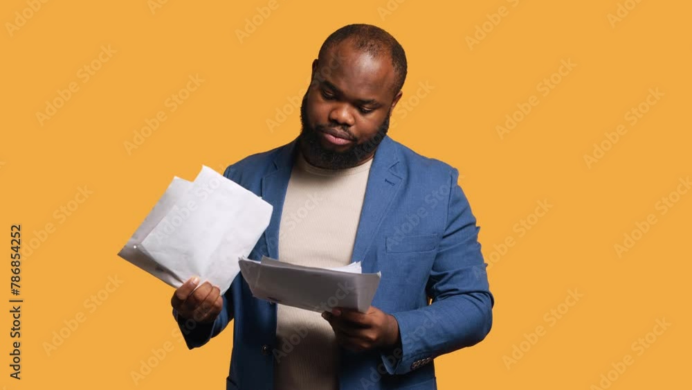 Accountant doing profit analysis for company, throwing files in air, feeling overworked, studio background. African american worker doing financial budgeting, having outburst, annoyed by too much work Accountant doing profit analysis for company, throwing files in air, feeling overworked, studio background. African american worker doing financial budgeting, having outburst, annoyed by too much work