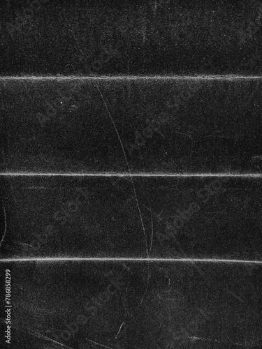 Beautiful Black grunge folded texture. Folded paper background with scratches and dust. Old folded paper texture for your design.