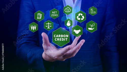 Green energy  Carbon credit market concept  Businessman holding Carbon credit icon  Net zero  Green energy icon. Carbon Neutral in industry Net zero emission eco energy.