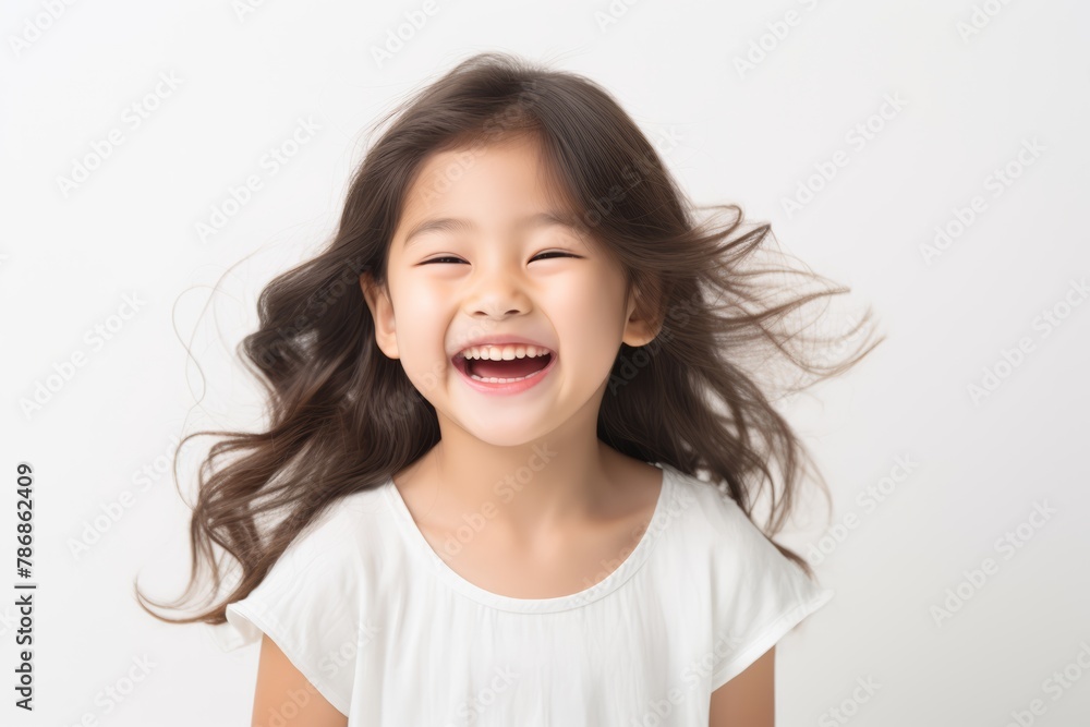 A beautiful Asian woman with long straight hair whose skin is tan is wearing an all white shirt, and smiling with a face which is full of happiness in a white room. Generative AI. A beautiful Asian woman with long straight hair whose skin is tan is wearing an all white shirt, and smiling with a face which is full of happiness in a white room. Generative AI.