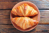 Croissants on a brown plate