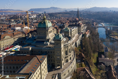 Bern, Switzerland: Aerial view of the Parliament building, the Bundeshaus in German, along the Aar river in early morning on sunny winter day. photo