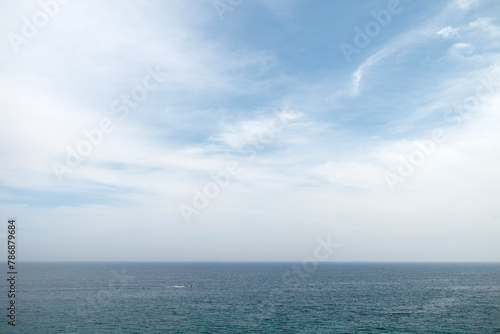 Seascape with the horizon and clouds