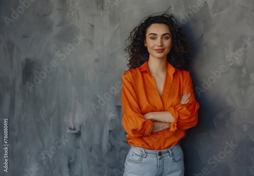 Self-Assured Young Lady with a Confident Stance in Orange Attire