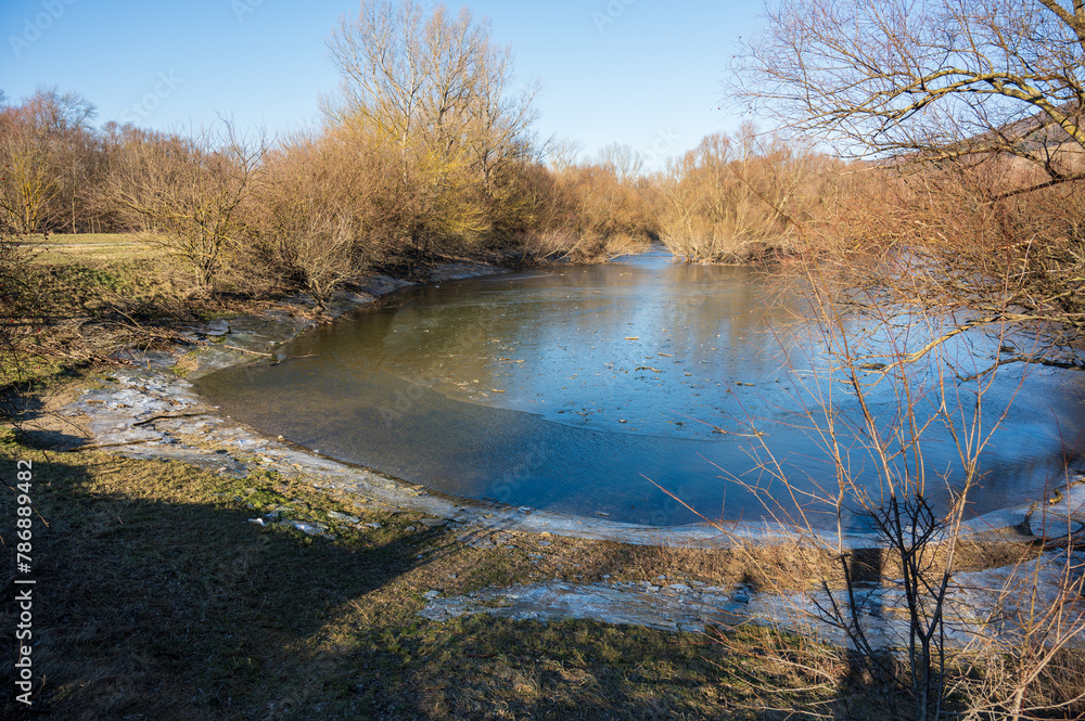 Frozen lake in the autumn forest. Frozen lake in the autumn forest.