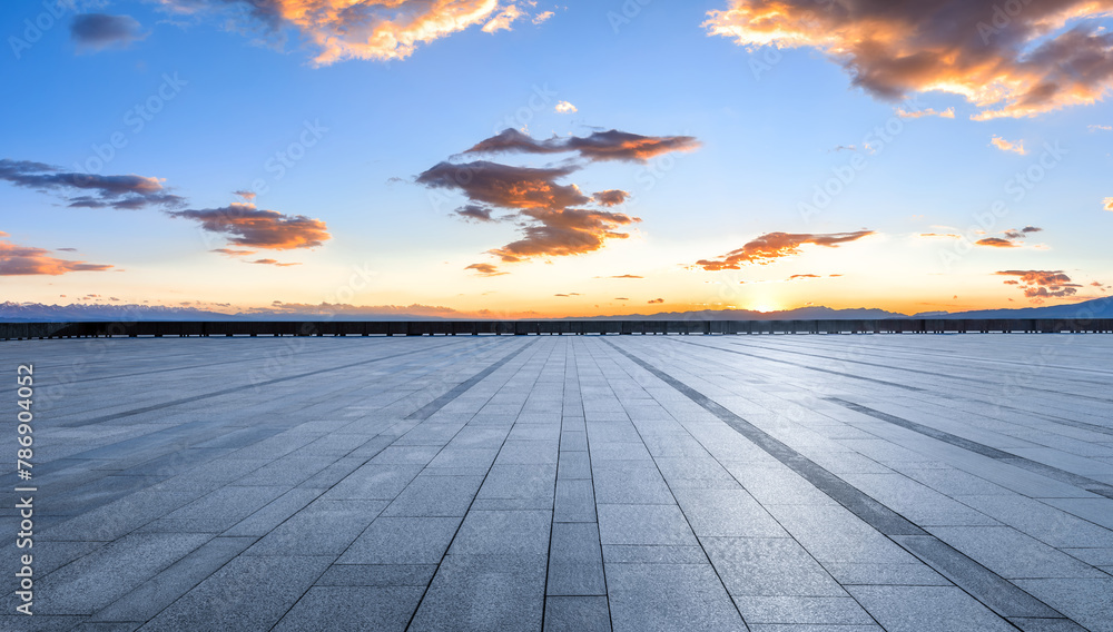 Empty square floor with sky clouds at sunset