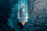 A bird's-eye view captures a luxurious cruise ship sailing through the deep blue ocean, leaving a wake behind..