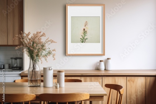 A cozy kitchen with a table, chairs, and a beautiful picture hanging on the wall © Umar