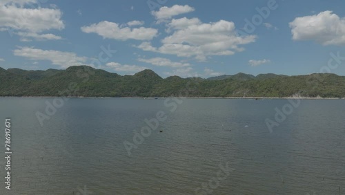 Cage Tilapia fish farming, Hatillo dam in Dominican Republic. Aerial forward at low altitude and copy space photo