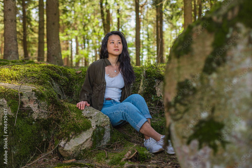 Asian woman sitting down in the forest.jpg Asian woman sitting down in the forest.jpg