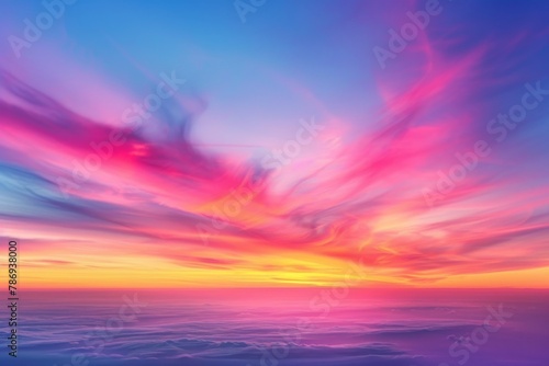 Soft, feathery stratospheric clouds in a gradient of sunset colors ranging from yellow to deep red, set against a clear evening sky, creating a smooth and soothing transition photo