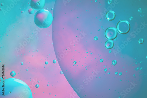Abstract blue and purple colorful background with oil on water surface. Oil drops in water abstract psychedelic, abstract image.