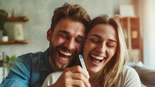 Young couple is excitedly hugging at home, celebrating the positive result of a pregnancy test.