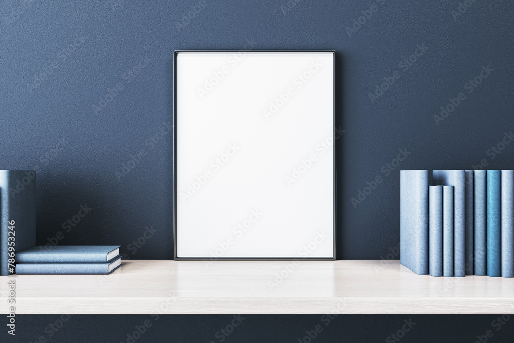 Close up of creative wooden designer desk with books and empty white mock up banner on blue concrete wall. 3D Rendering. Close up of creative wooden designer desk with books and empty white mock up banner on blue concrete wall. 3D Rendering.