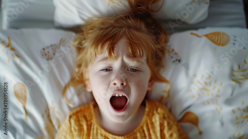 A sleepy little girl yawning in bed. Perfect for illustrating bedtime routines