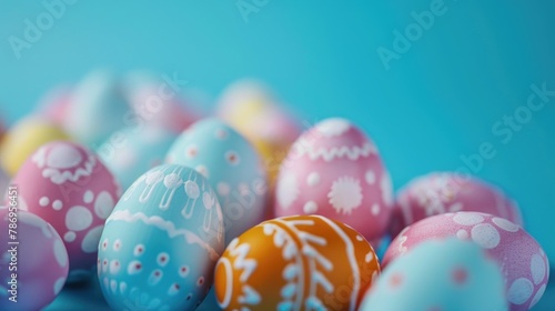 Colorful Easter eggs on a blue surface, perfect for Easter holiday designs