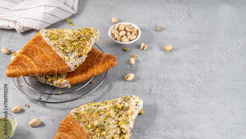 Flat Croissant, Trendy Pastry, Croissant with Pistachio photo