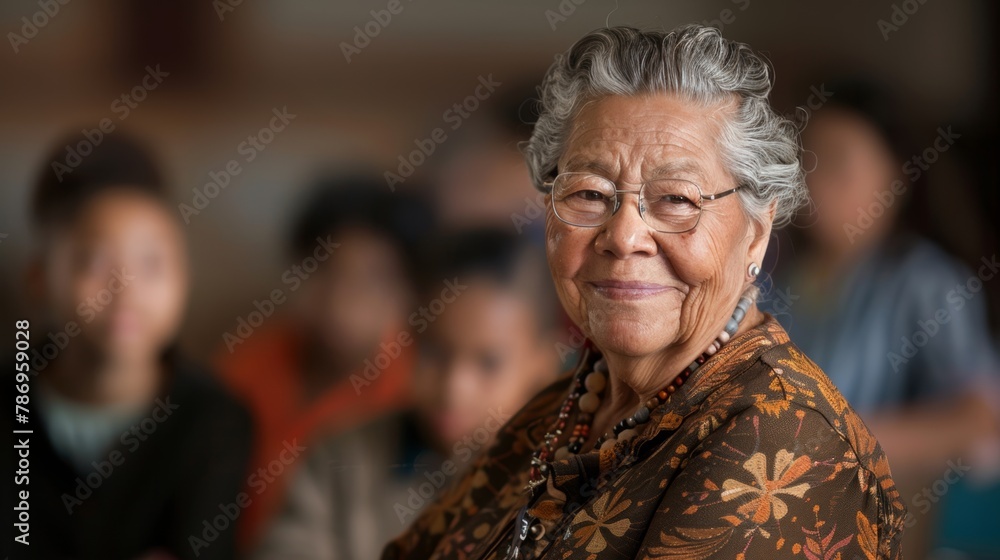 A close-up portrait of a smiling elderly woman with glasses and a traditional necklace, exuding wisdom and warmth. A close-up portrait of a smiling elderly woman with glasses and a traditional necklace, exuding wisdom and warmth.