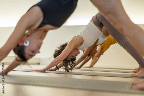Close-up of yoga students in a studio.