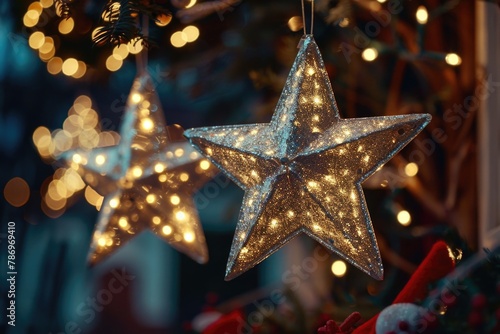A close up of a star ornament hanging from a tree. Can be used for holiday decorations