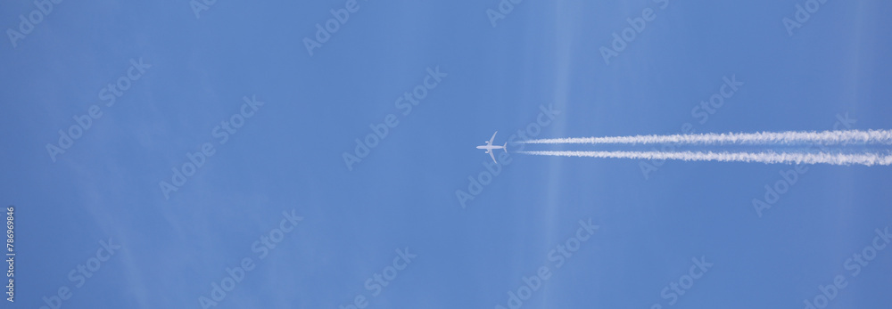 double airplane trail in the blue sky double airplane trail in the blue sky