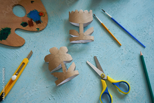 Kids craft flowers out of recycling toilet paper roll, zero waste concept. Step by step tutorial - 3.