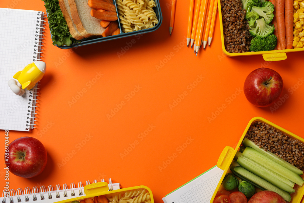 Yellow lunch box with delicious food and school supplies